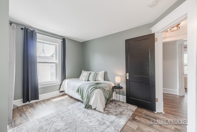 129 Dean St NE, Grand Rapids, MI 49505 - bedroom with multiple windows and wood finished floors