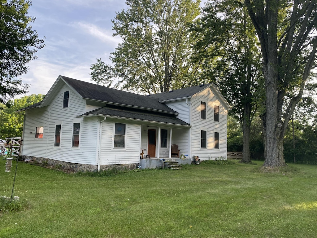 15775 Cassidy Rd, Chelsea, MI 48118 - rear view of house with a yard