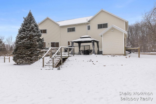 1932 Buehler Rd, Hastings, MI 49058 - snow covered house with a gazebo and a wooden deck