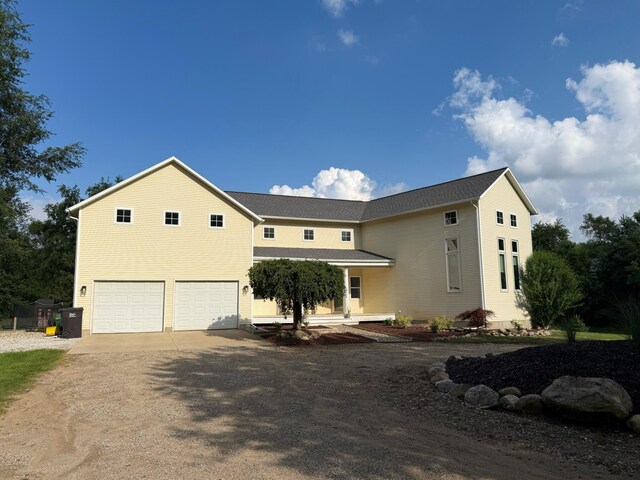 1932 Buehler Rd, Hastings, MI 49058 - view of front facade featuring an attached garage and dirt driveway