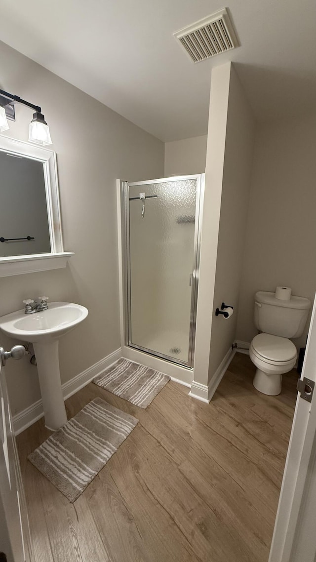 1932 Buehler Rd, Hastings, MI 49058 - bathroom featuring wood finished floors and a shower stall