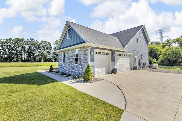 9430 Island Lake Rd, Dexter, MI 48130 - view of side of property with concrete driveway, a garage, a yard, stone siding, and roof with shingles