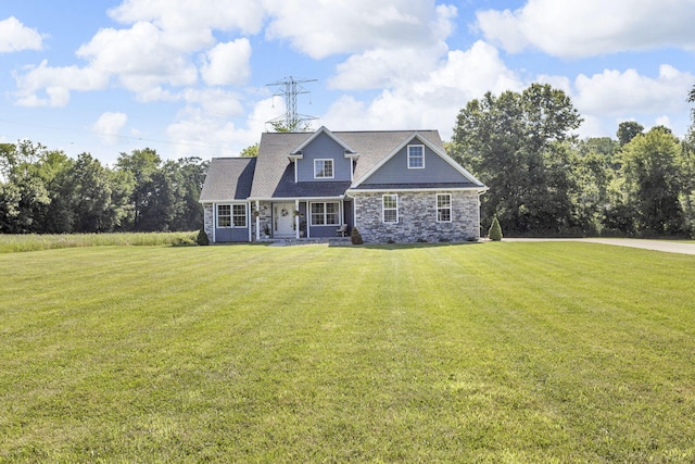 9430 Island Lake Rd, Dexter, MI 48130 - view of front facade featuring a front yard, stone siding, and covered porch