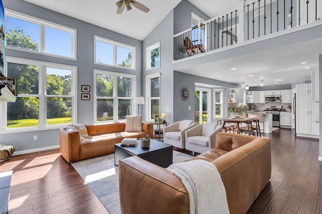 9430 Island Lake Rd, Dexter, MI 48130 - living room with ceiling fan, high vaulted ceiling, healthy amount of natural light, dark wood-style flooring, and recessed lighting