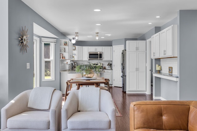 9430 Island Lake Rd, Dexter, MI 48130 - kitchen with stainless steel appliances, decorative backsplash, white cabinetry, open shelves, and recessed lighting