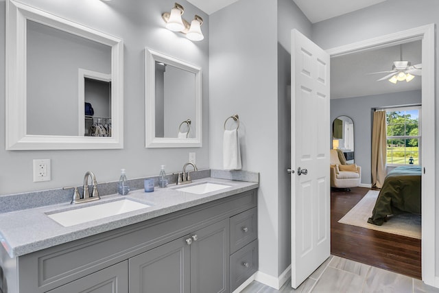 9430 Island Lake Rd, Dexter, MI 48130 - ensuite bathroom featuring double vanity and ceiling fan