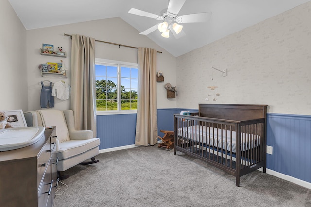9430 Island Lake Rd, Dexter, MI 48130 - bedroom with a wainscoted wall, lofted ceiling, a crib, carpet, and ceiling fan
