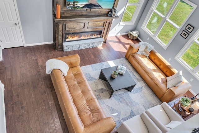 9430 Island Lake Rd, Dexter, MI 48130 - living room featuring wood finished floors and a stone fireplace