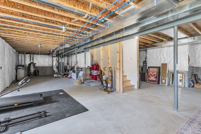 9430 Island Lake Rd, Dexter, MI 48130 - unfinished basement with stairway and water heater