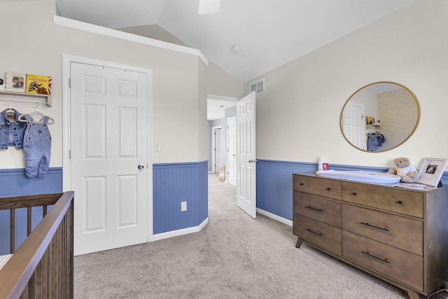 9430 Island Lake Rd, Dexter, MI 48130 - carpeted bedroom featuring vaulted ceiling and a wainscoted wall