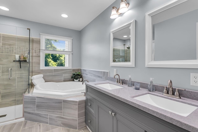 9430 Island Lake Rd, Dexter, MI 48130 - full bath featuring a stall shower, double vanity, a garden tub, and recessed lighting