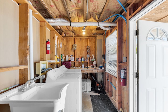 699 116th St, Ocean, Marathon, FL 33050 - laundry room featuring wooden walls, a sink, and washing machine and clothes dryer