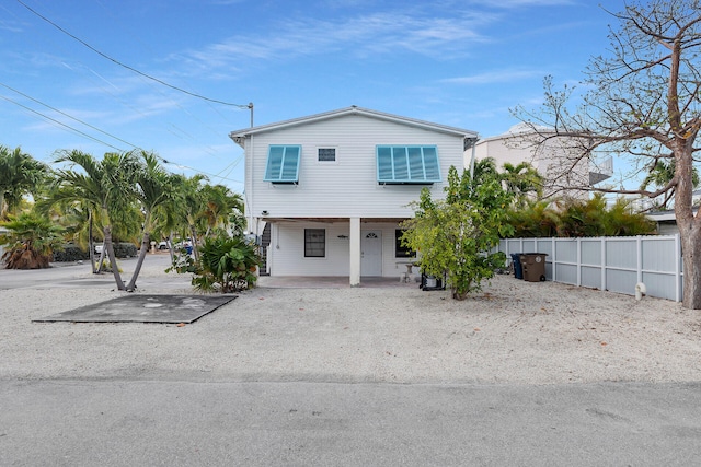 699 116th St, Ocean, Marathon, FL 33050 - view of front of home with fence and a porch