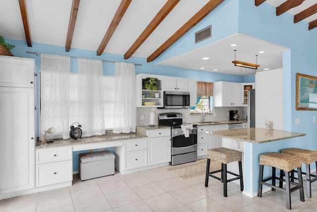 699 116th St, Ocean, Marathon, FL 33050 - kitchen with appliances with stainless steel finishes, a breakfast bar, visible vents, and open shelves