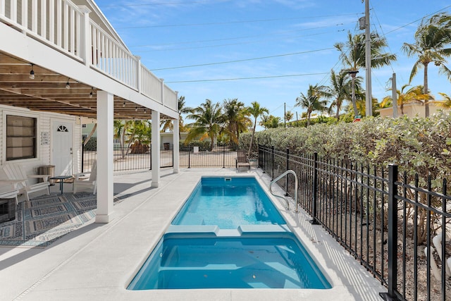 699 116th St, Ocean, Marathon, FL 33050 - view of swimming pool featuring fence, a patio, and a pool with connected hot tub