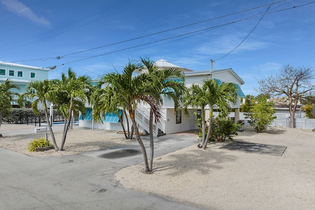 699 116th St, Ocean, Marathon, FL 33050 - view of front of house featuring fence, a carport, and driveway