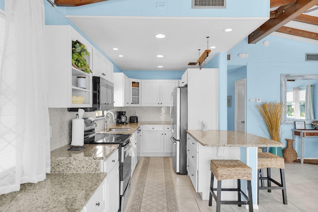 699 116th St, Ocean, Marathon, FL 33050 - kitchen with white cabinetry, tasteful backsplash, stainless steel appliances, and a sink