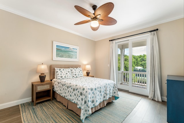 81250 Overseas Hwy Unit 1, Islamorada, FL 33036 - bedroom featuring access to exterior, wood finished floors, crown molding, and a ceiling fan