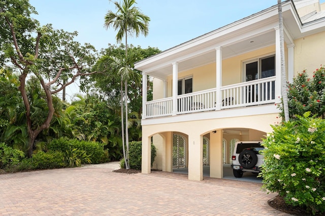 81250 Overseas Hwy Unit 1, Islamorada, FL 33036 - view of property exterior with stucco siding and a carport
