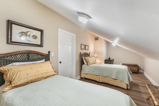 81250 Overseas Hwy Unit 1, Islamorada, FL 33036 - bedroom with vaulted ceiling and wood finished floors