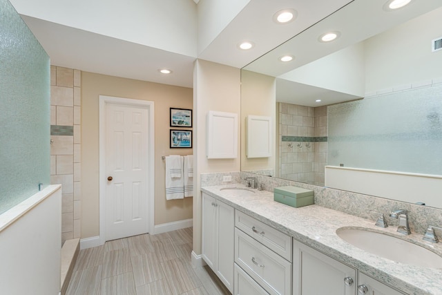 81250 Overseas Hwy Unit 1, Islamorada, FL 33036 - full bathroom featuring double vanity, recessed lighting, and a walk in shower