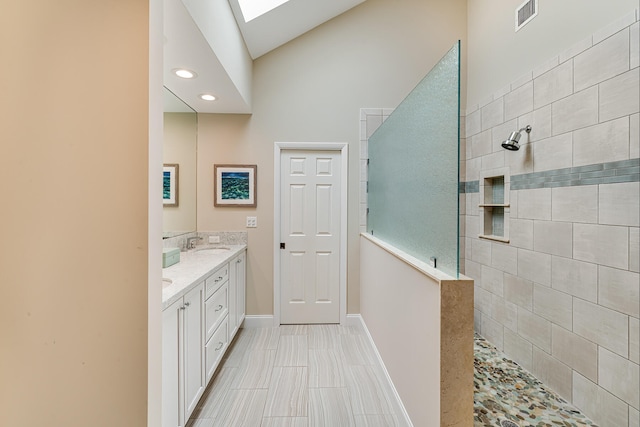 81250 Overseas Hwy Unit 1, Islamorada, FL 33036 - full bathroom featuring double vanity, a walk in shower, a skylight, and recessed lighting