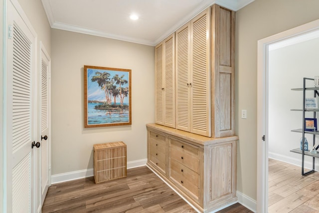 81250 Overseas Hwy Unit 1, Islamorada, FL 33036 - hallway with light wood-style flooring, ornamental molding, and recessed lighting