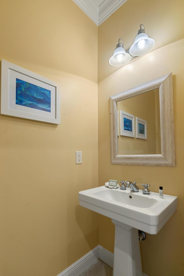 2600 Overseas Hwy Unit 87, Marathon, FL 33050 - bathroom featuring crown molding and sink