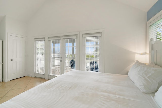 2600 Overseas Hwy Unit 87, Marathon, FL 33050 - tiled bedroom featuring access to exterior, high vaulted ceiling, and french doors