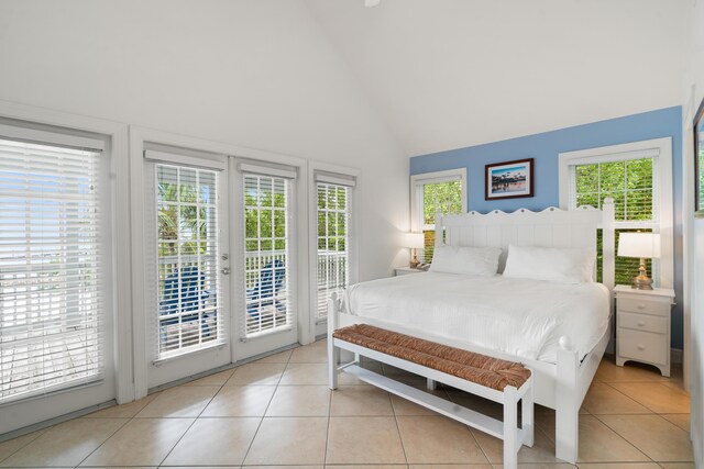 2600 Overseas Hwy Unit 87, Marathon, FL 33050 - bedroom featuring access to exterior, multiple windows, and light tile patterned floors