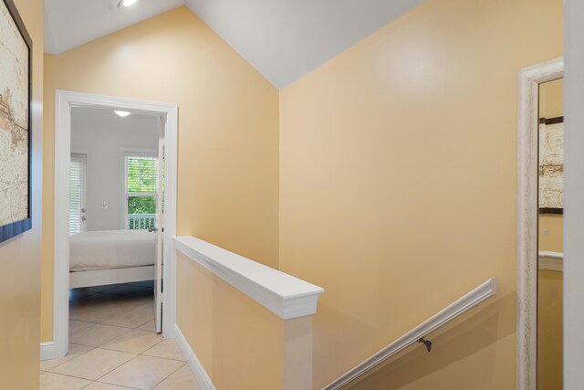 2600 Overseas Hwy Unit 87, Marathon, FL 33050 - hallway featuring light tile patterned floors and vaulted ceiling