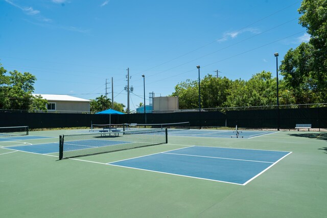 97501 Overseas Hwy Unit 131, Key Largo, FL 33037 - view of tennis court featuring community basketball court