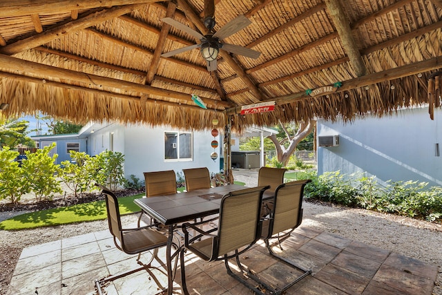 view of patio / terrace featuring a gazebo, outdoor dining area, and ceiling fan