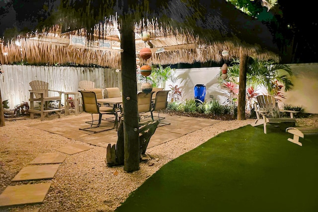 view of patio / terrace with outdoor dining area and fence