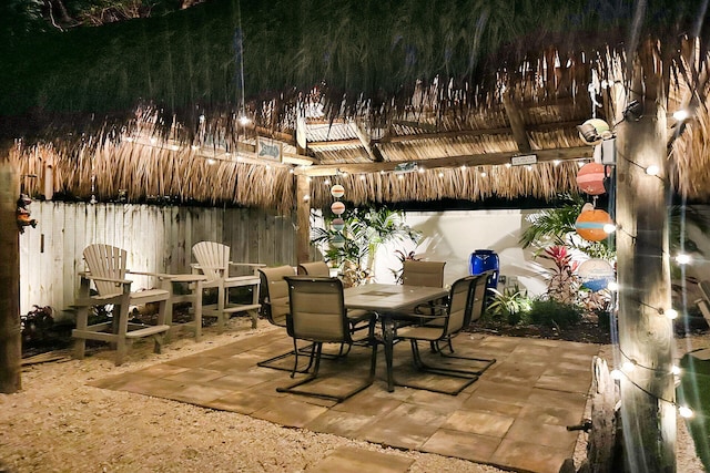 view of patio / terrace featuring outdoor dining area and fence
