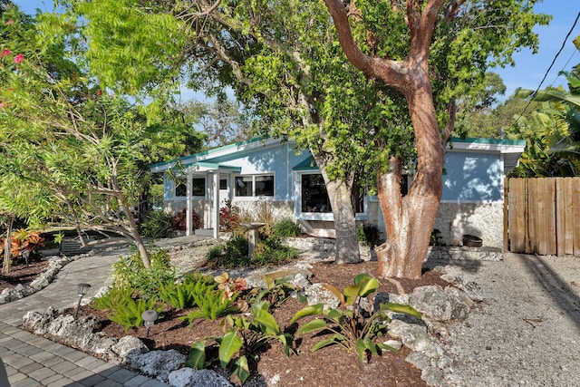 view of front of home featuring fence