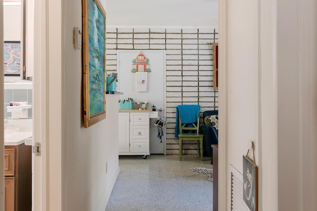 230 Apache St, Tavernier, FL 33070 - home office featuring speckled floor and baseboards