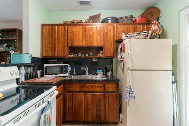 230 Apache St, Tavernier, FL 33070 - kitchen with white appliances, brown cabinets, decorative backsplash, and open shelves