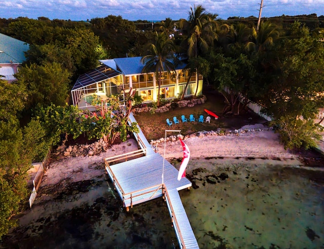 rear view of house featuring a lanai