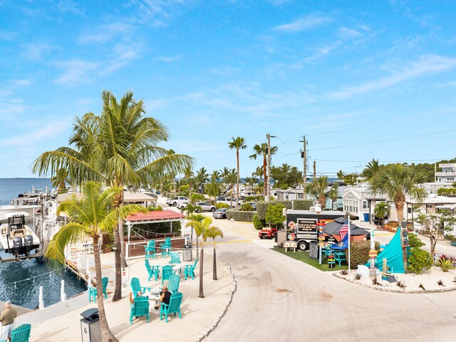 surrounding community featuring a water view