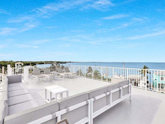 view of patio featuring a water view and outdoor lounge area