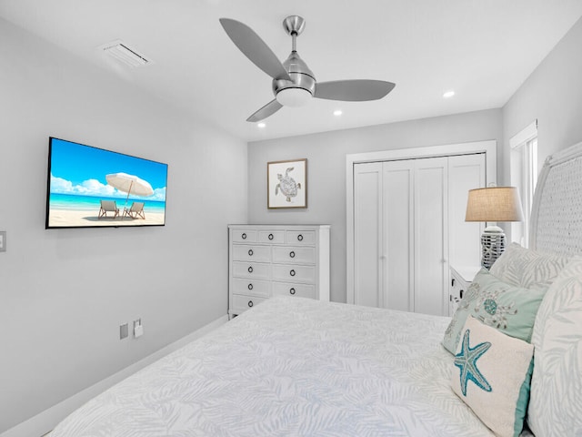 bedroom with ceiling fan and a closet