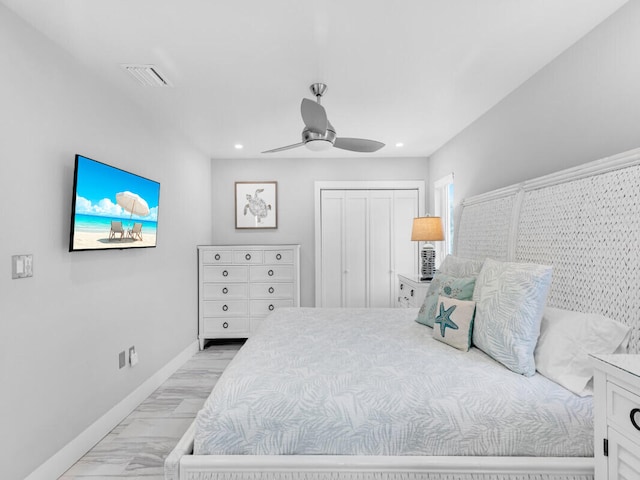 bedroom featuring ceiling fan and a closet