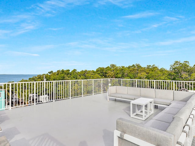 view of patio / terrace with an outdoor living space and a water view