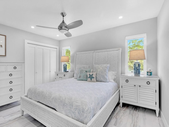 bedroom featuring ceiling fan and a closet