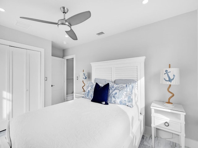 bedroom featuring ceiling fan and a closet