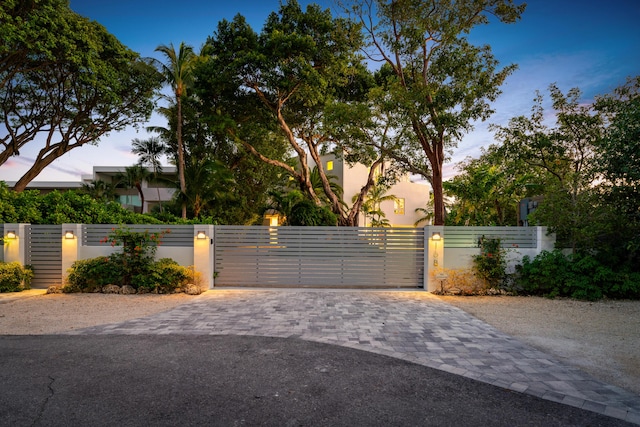 view of gate at dusk