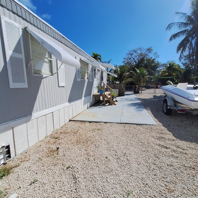 view of side of home with a patio