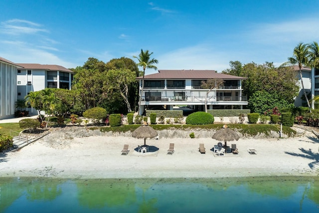 back of property featuring a water view