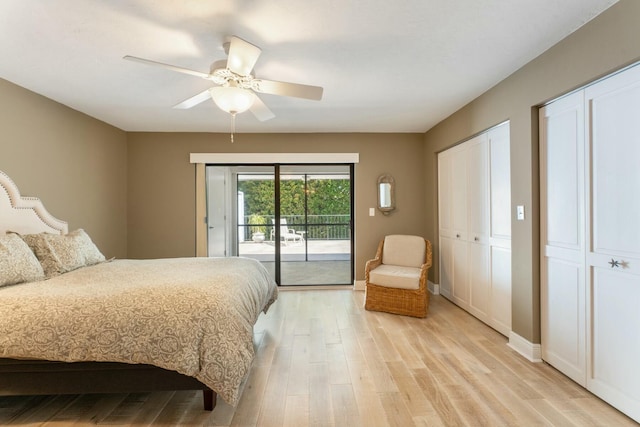 bedroom featuring a ceiling fan, baseboards, access to exterior, light wood-style floors, and two closets